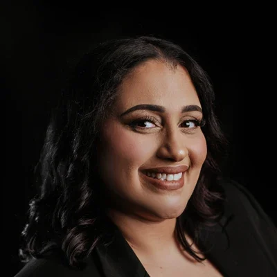 Nicole Mercado is Smiling Happily at Potential Patients Looking at Her Bio